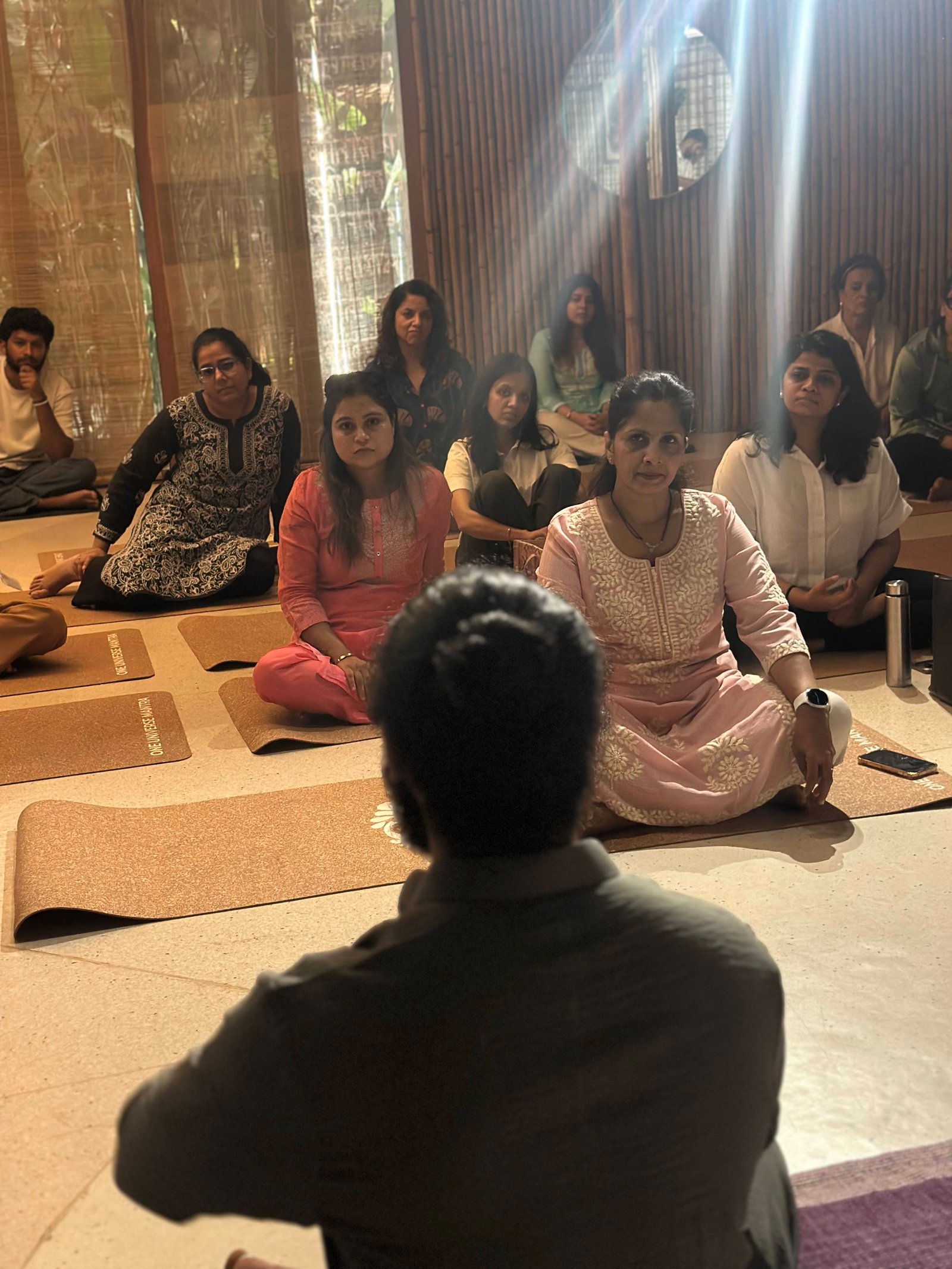 Participants seated on mats during a community workshop at Mahati Wellness, Bandra