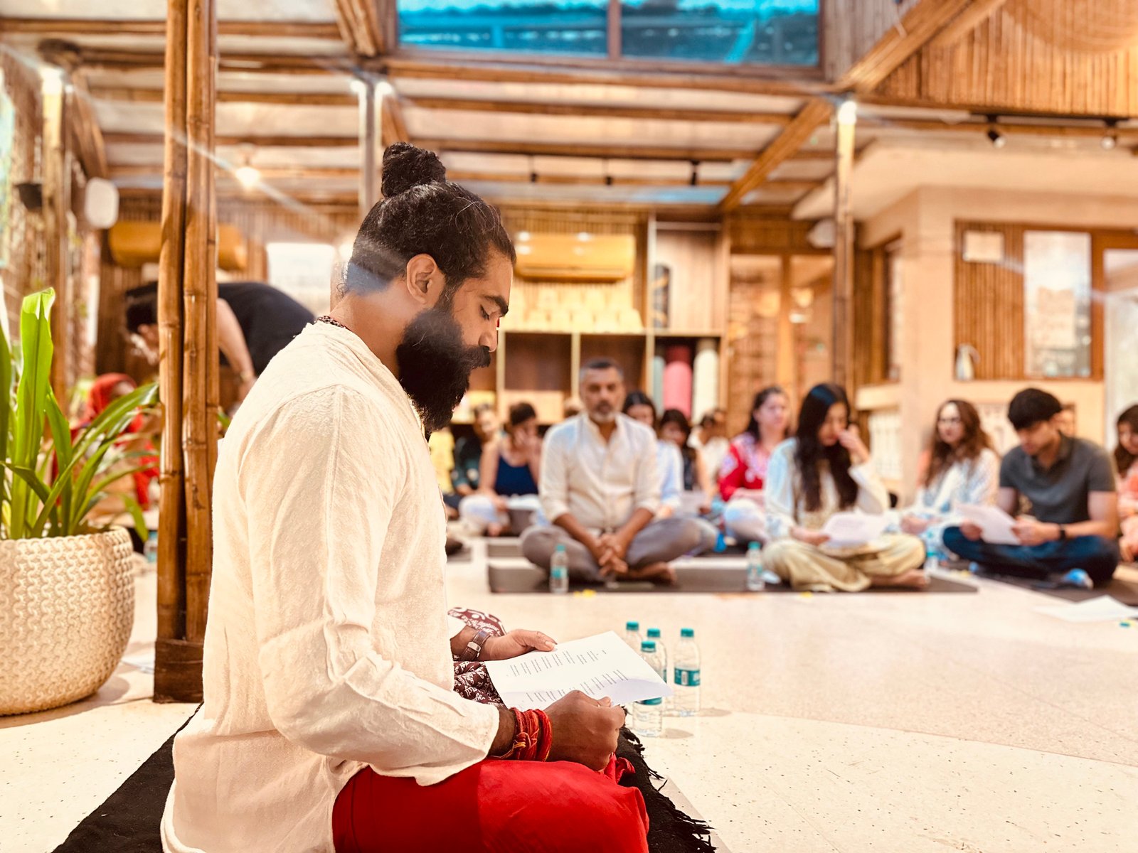 Reading the verses together at the Bhagavad Gita workshop, Mahati Wellness
